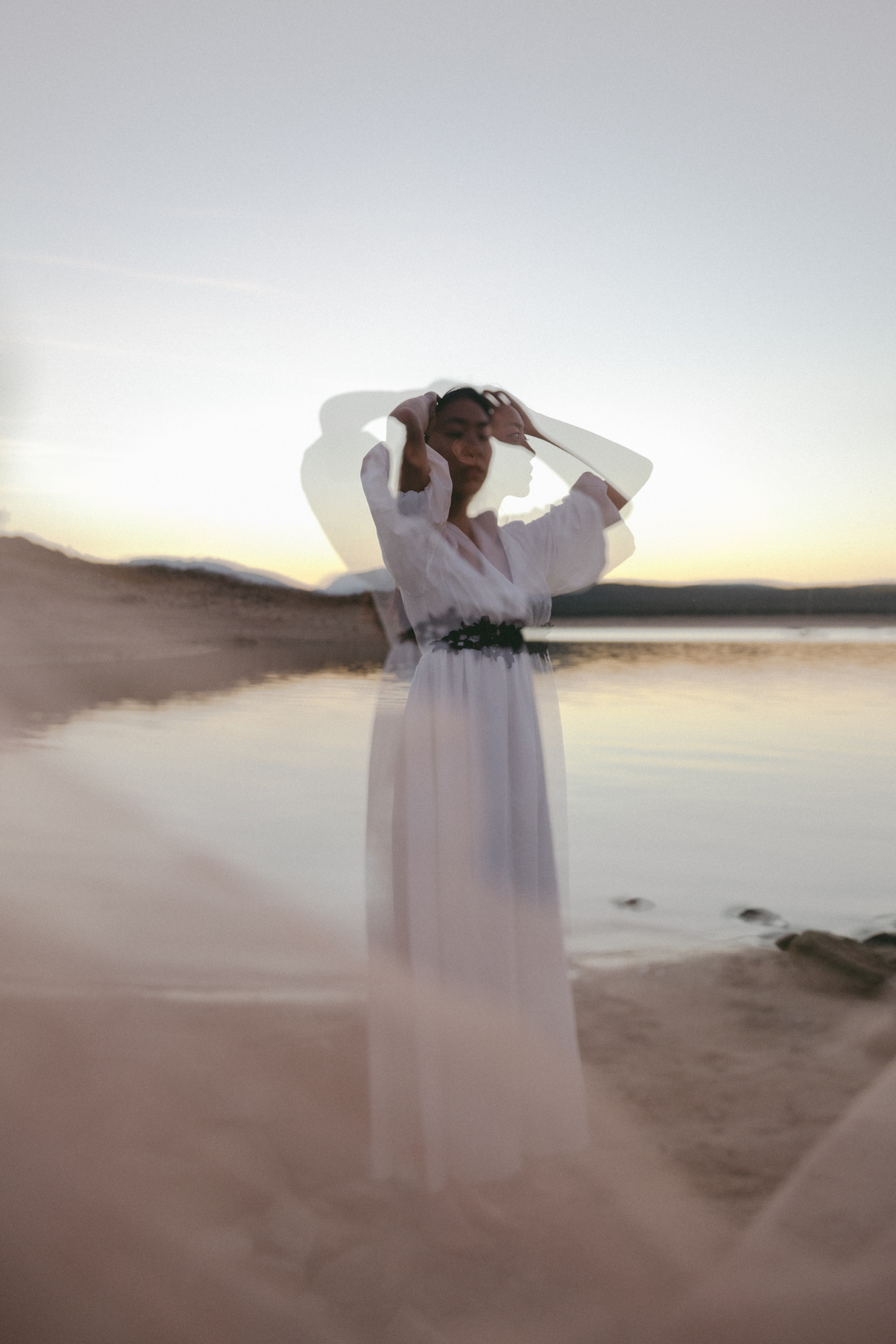 Woman in Sheer Dress at the Beach